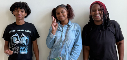 Three young people standing together